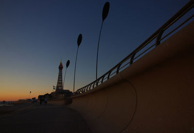 Low angle view of bridge against sky during sunset