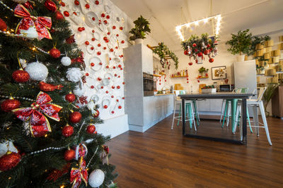 Interior of a cozy modern spacious kitchen for a large family, decorated for  new year celebration