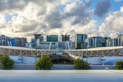 Modern buildings against sky in city