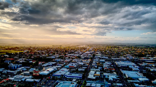High angle view of buildings against sky during sunset