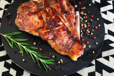 High angle view of meat on barbecue grill