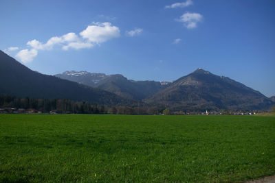 Scenic view of landscape and mountains against sky