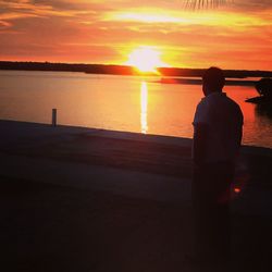 Silhouette of people at sunset