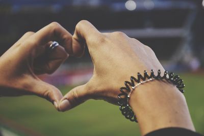 Close-up of hands against blurred background