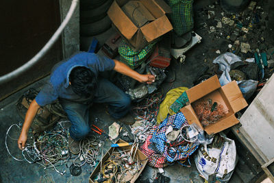 Low section of man working at market stall