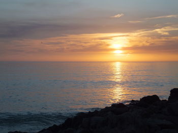 Scenic view of sea at sunset