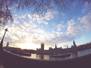 View of buildings against cloudy sky at sunset