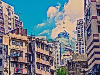 Low angle view of buildings against blue sky