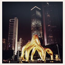 Low angle view of statue at night