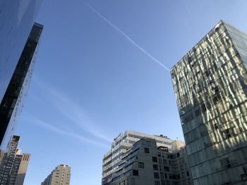 Low angle view of buildings against clear blue sky