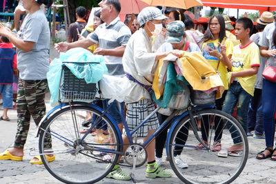 People standing on street in city