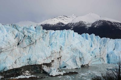 Moreno glacier with snowcapped mountains in background