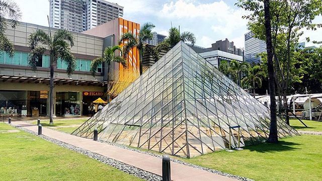 architecture, building exterior, built structure, grass, sky, lawn, tree, day, sunlight, outdoors, green color, cloud - sky, no people, facade, footpath, city, park - man made space, house, cloud, building