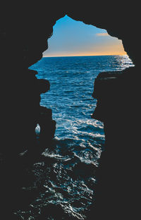 Scenic view of sea against sky at sunset