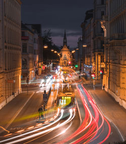 High angle view of light trails on road at night