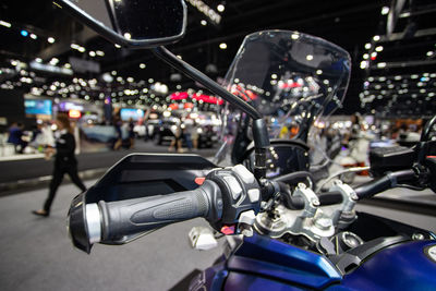 Close-up of motorcycle on street in city