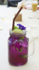 Close-up of drink in glass jar on table