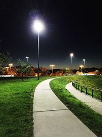 Illuminated footpath at night