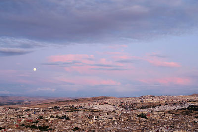 Aerial view of townscape against sky