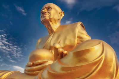 Low angle view of statue against sky