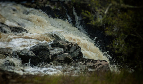 Close-up of rocks in water