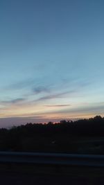 Scenic view of silhouette landscape against sky at sunset