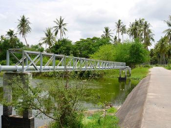 Bridge over canal against sky