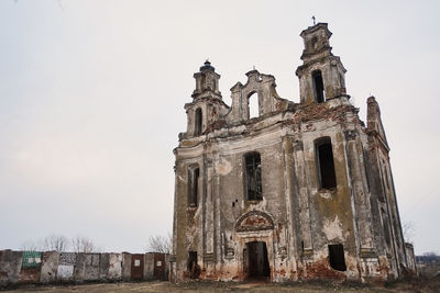 Low angle view of old building against sky