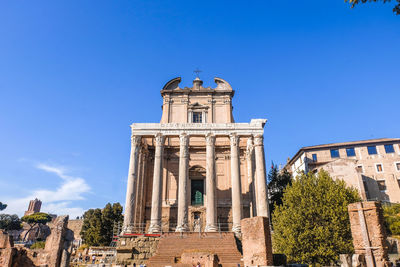 Low angle view of historical building against blue sky