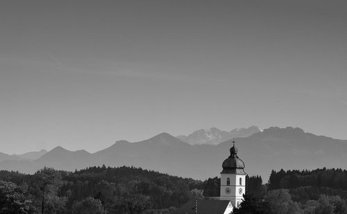 View of building and mountains against sky