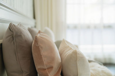 Close-up of pillows on bed at home