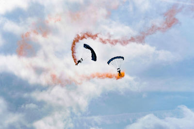 Low angle view of kite flying against sky