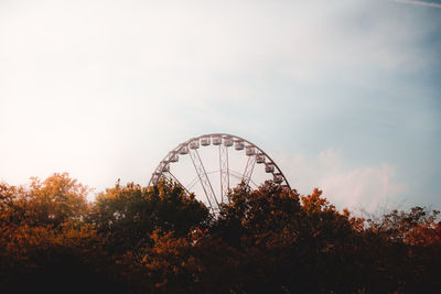 Low angle view of ferris wheel against sky