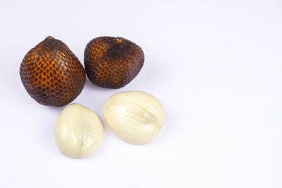 Close-up of fruits against white background