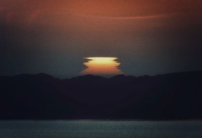 Scenic view of sea against sky at sunset
