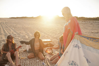 Friends hanging out together on a beach