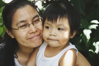 Close-up of mother with son outdoors