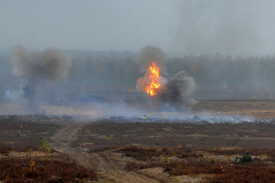 Bonfire on land against sky