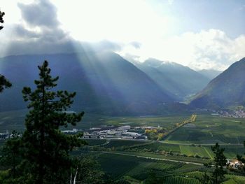 Scenic view of mountains against cloudy sky