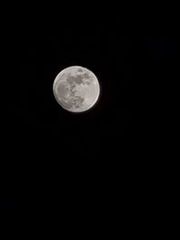 Low angle view of moon against sky at night