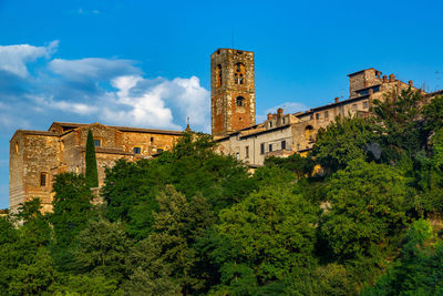 Low angle view of historic building against blue sky