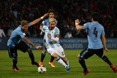 Men running on soccer field