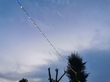 Low angle view of silhouette tree against sky