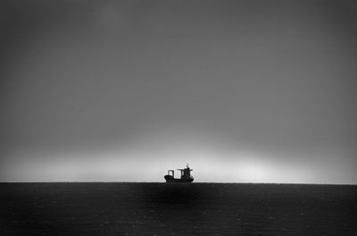 Scenic view of lighthouse by sea against sky