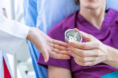 Midsection of woman holding hands