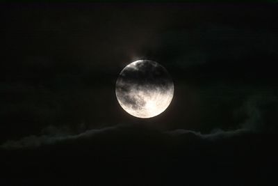 Low angle view of moon against sky at night