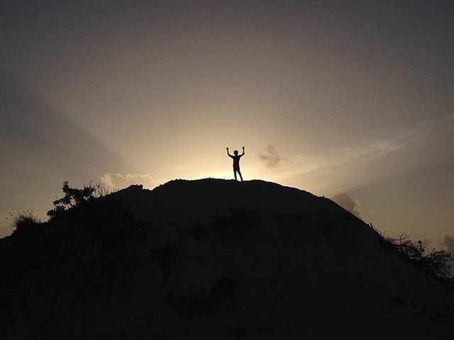 silhouette, sky, tranquility, tranquil scene, copy space, one person, sunset, scenics, low angle view, beauty in nature, nature, dusk, mountain, landscape, outline, idyllic, hill, cloud - sky, outdoors, cloud