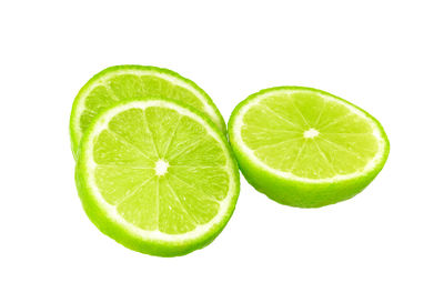 Close-up of lemon slice over white background