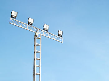 Low angle view of information sign against clear sky