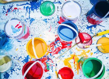 High angle view of various paint on table
